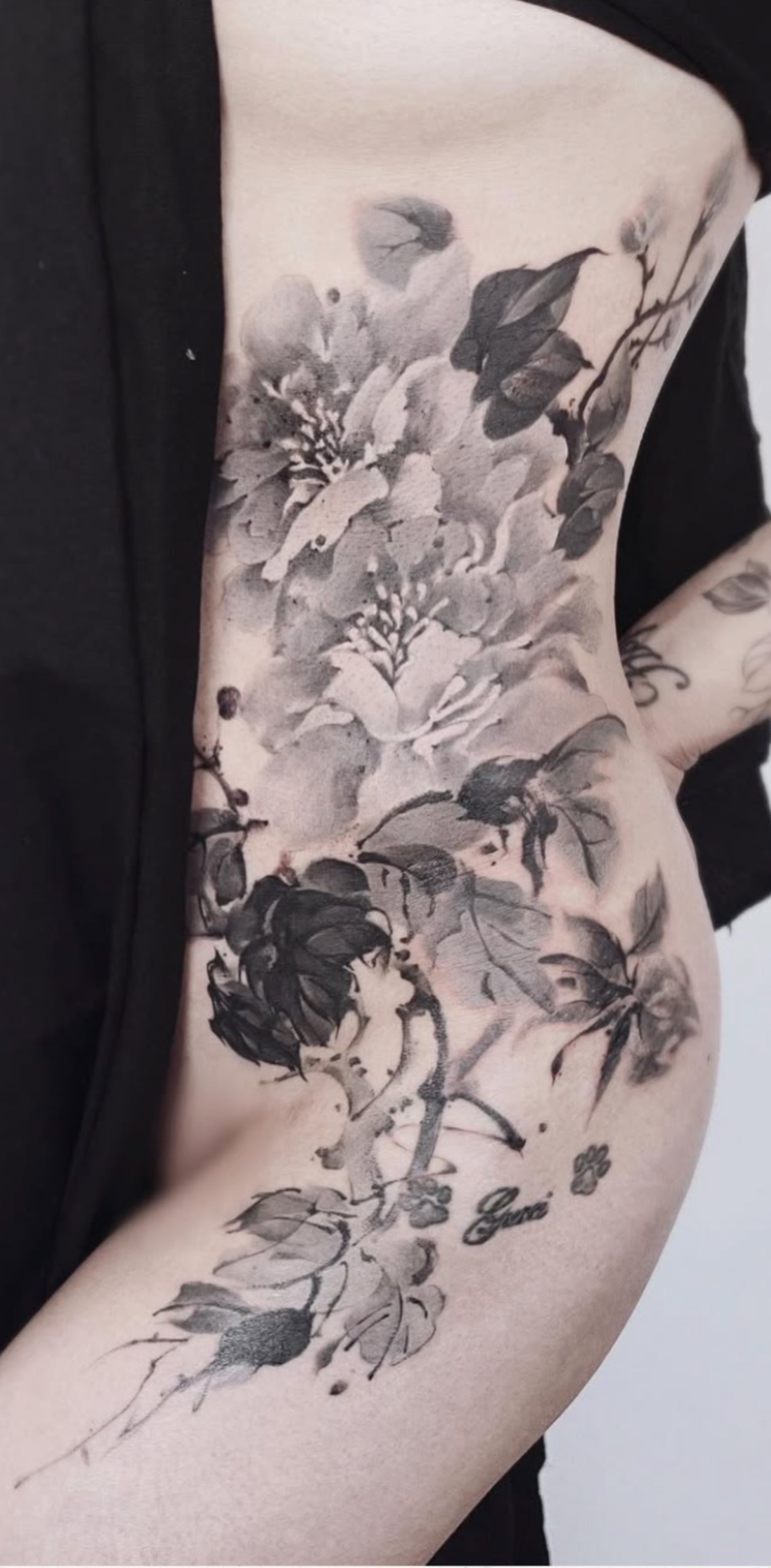Inkwash floral tattoo by Iriss at Blank-Leaving Tattoo Studio in Auckland