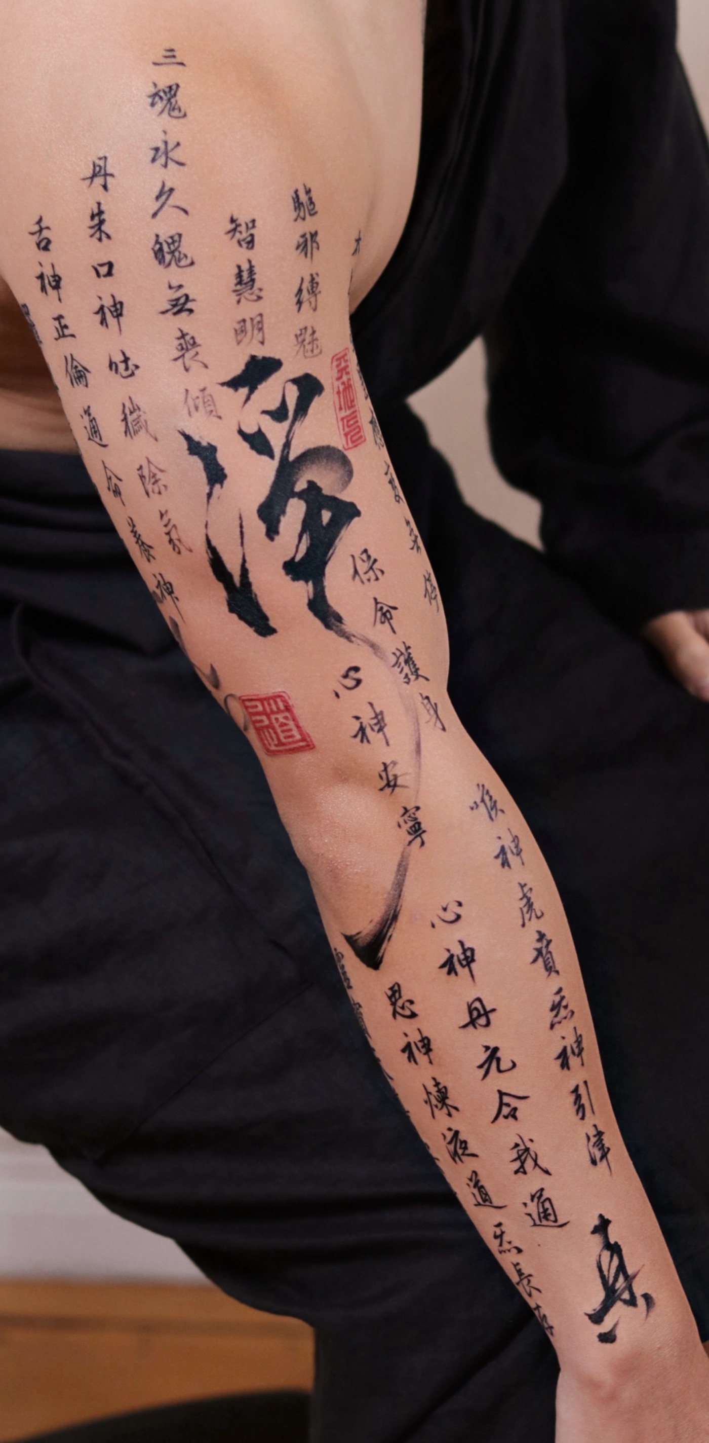 Chinese calligraphy tattoo by Raina at Blank-Leaving Tattoo Studio in Auckland